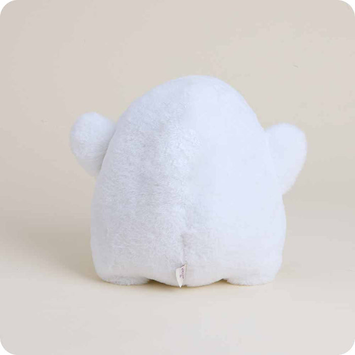 White plush toy on a beige background
