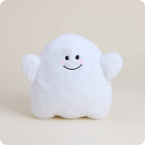 Plush ghost toy with a smiling face on a beige background